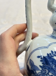 A Chinese blue and white ewer and cover with floral design, Kangxi