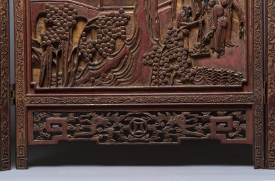 A Chinese carved gilt-lacquered wooden three-panel folding screen with a narrative design, 19/20th C.