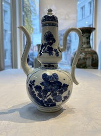 A Chinese blue and white ewer and cover with floral design, Kangxi
