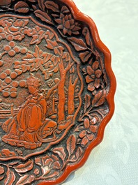 A fine Chinese red cinnabar lacquer flower-shaped 'Xi Wang Mu 西王母' dish, Ming