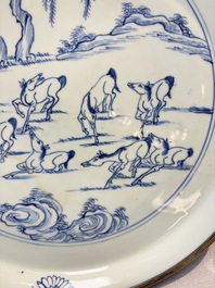 A rare Chinese silver-mounted blue and white 'Eight Horses of Mu Wang' dish, Kangxi