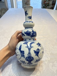 A Chinese blue and white double gourd 'Antiquities' vase, Kangxi