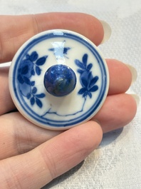 A Chinese blue and white covered ewer, a rose water sprinkler, a covered cup and saucer, jade 玉 and twin-fish mark, Kangxi