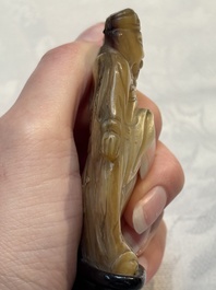 A Chinese carved mother-of-pearl figure of an official on wooden stand, 18/19th C.