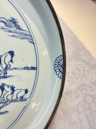 A rare Chinese silver-mounted blue and white 'Eight Horses of Mu Wang' dish, Kangxi