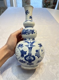 A Chinese blue and white double gourd 'Antiquities' vase, Kangxi