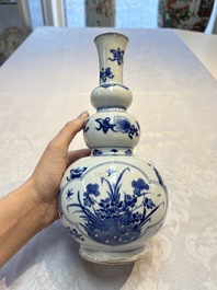 A Chinese blue and white double gourd 'Antiquities' vase, Kangxi