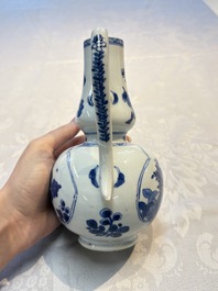 A Chinese blue and white ewer and cover with floral design, Kangxi