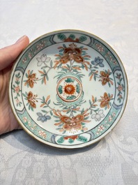 Five Chinese famille verte cups and saucers with floral design, 19th C.