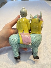 A pair of Chinese famille rose models of a boy riding a qilin and a bitong, 19/20th C.