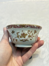 A pair of Chinese famille rose gilt-decorated covered cups and saucers and an openworked cup, Qianlong