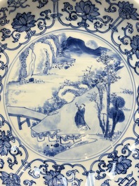 A very fine Chinese blue and white plate with a scholar in a landscape, Kangxi mark and of the period