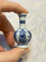 A group of 12 Chinese blue and white miniature vases and a small bottle vase, Kangxi