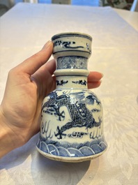 A pair of Chinese blue and white 'Dragons Chasing the Flaming Pearl&rsquo; candlesticks, 19th C.