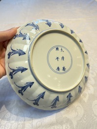 A very fine Chinese blue and white plate with a scholar in a landscape, Kangxi mark and of the period