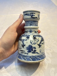A pair of Chinese blue and white 'Dragons Chasing the Flaming Pearl&rsquo; candlesticks, 19th C.