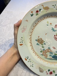 Four Chinese famille rose 'Roosters' plates and a 'Crane' dish, Qianlong