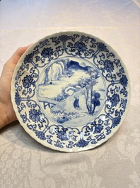 A very fine Chinese blue and white plate with a scholar in a landscape, Kangxi mark and of the period