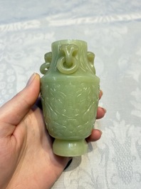 A Chinese celadon jade covered vase, with wooden stand, and a bowl with wooden cover and stand, 19/20th C.