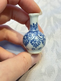 A group of 12 Chinese blue and white miniature vases and a small bottle vase, Kangxi