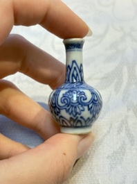 A group of 12 Chinese blue and white miniature vases and a small bottle vase, Kangxi