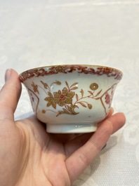 A pair of Chinese famille rose gilt-decorated covered cups and saucers and an openworked cup, Qianlong