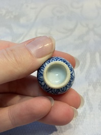 A group of 12 Chinese blue and white miniature vases and a small bottle vase, Kangxi