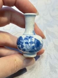 A group of 12 Chinese blue and white miniature vases and a small bottle vase, Kangxi