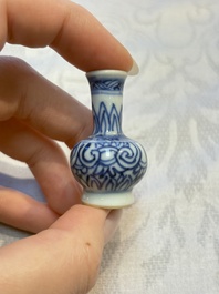 A group of 12 Chinese blue and white miniature vases and a small bottle vase, Kangxi