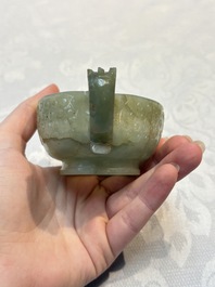 A Chinese celadon jade covered vase, with wooden stand, and a bowl with wooden cover and stand, 19/20th C.