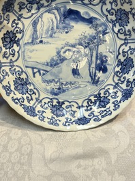 A very fine Chinese blue and white plate with a scholar in a landscape, Kangxi mark and of the period