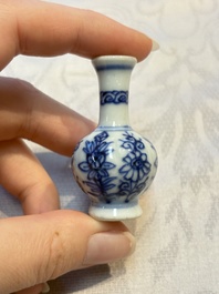 A group of 12 Chinese blue and white miniature vases and a small bottle vase, Kangxi