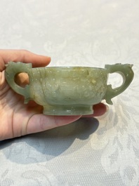 A Chinese celadon jade covered vase, with wooden stand, and a bowl with wooden cover and stand, 19/20th C.