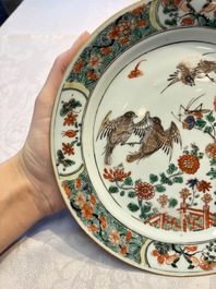 A pair of Chinese famille verte 'Birds Among Flowering Branches' plates, Kangxi