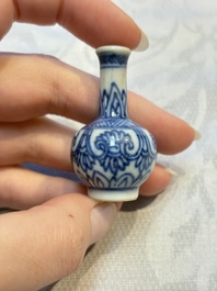 A group of 12 Chinese blue and white miniature vases and a small bottle vase, Kangxi