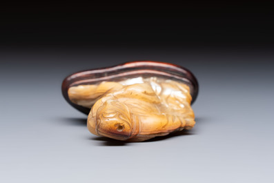 A Chinese carved mother-of-pearl figure of an official on wooden stand, 18/19th C.