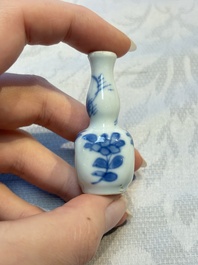 A group of 12 Chinese blue and white miniature vases and a small bottle vase, Kangxi