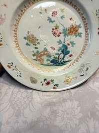 Four Chinese famille rose 'Roosters' plates and a 'Crane' dish, Qianlong