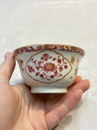A pair of Chinese famille rose gilt-decorated covered cups and saucers and an openworked cup, Qianlong