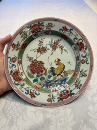 Four Chinese famille rose 'Roosters' plates and a 'Crane' dish, Qianlong