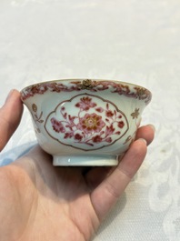 A pair of Chinese famille rose gilt-decorated covered cups and saucers and an openworked cup, Qianlong