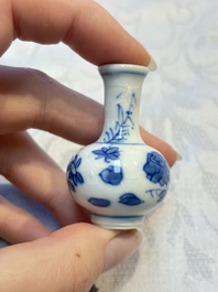 A group of 12 Chinese blue and white miniature vases and a small bottle vase, Kangxi