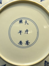 A very fine Chinese blue and white plate with a scholar in a landscape, Kangxi mark and of the period