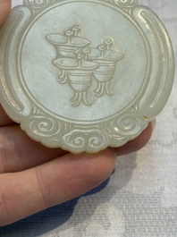 A Chinese celadon jade snuff bottle, a plaque and a ritual stick, Han and later