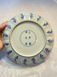 A very fine Chinese blue and white plate with a scholar in a landscape, Kangxi mark and of the period