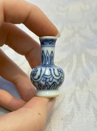 A group of 12 Chinese blue and white miniature vases and a small bottle vase, Kangxi