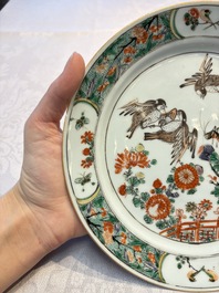 A pair of Chinese famille verte 'Birds Among Flowering Branches' plates, Kangxi