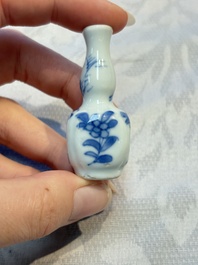 A group of 12 Chinese blue and white miniature vases and a small bottle vase, Kangxi