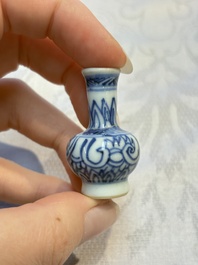 A group of 12 Chinese blue and white miniature vases and a small bottle vase, Kangxi