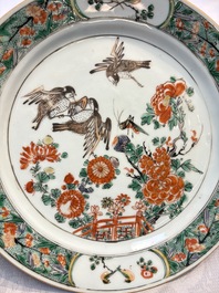 A pair of Chinese famille verte 'Birds Among Flowering Branches' plates, Kangxi